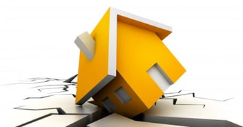 A graphic of a damaged home sitting on top of cracked ground