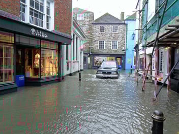 A flood damaged street, almost entirely submerged in water