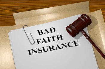 A file depicting a bad faith insurance claim sits on a desk