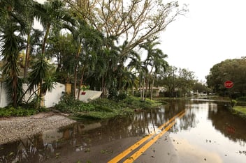 A Fort Lauderdale street is flooded and damaged after a hurricane.
