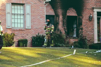 Firefighters inspect a fire damaged home in Florida.