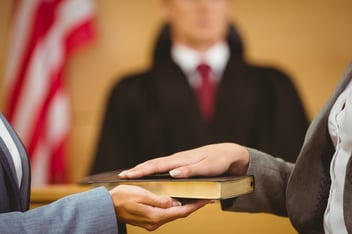 A swearing-in inside a federal court room, where insurance claim sometimes end up.