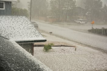 An image of a roof during a torrential down poor of rain.